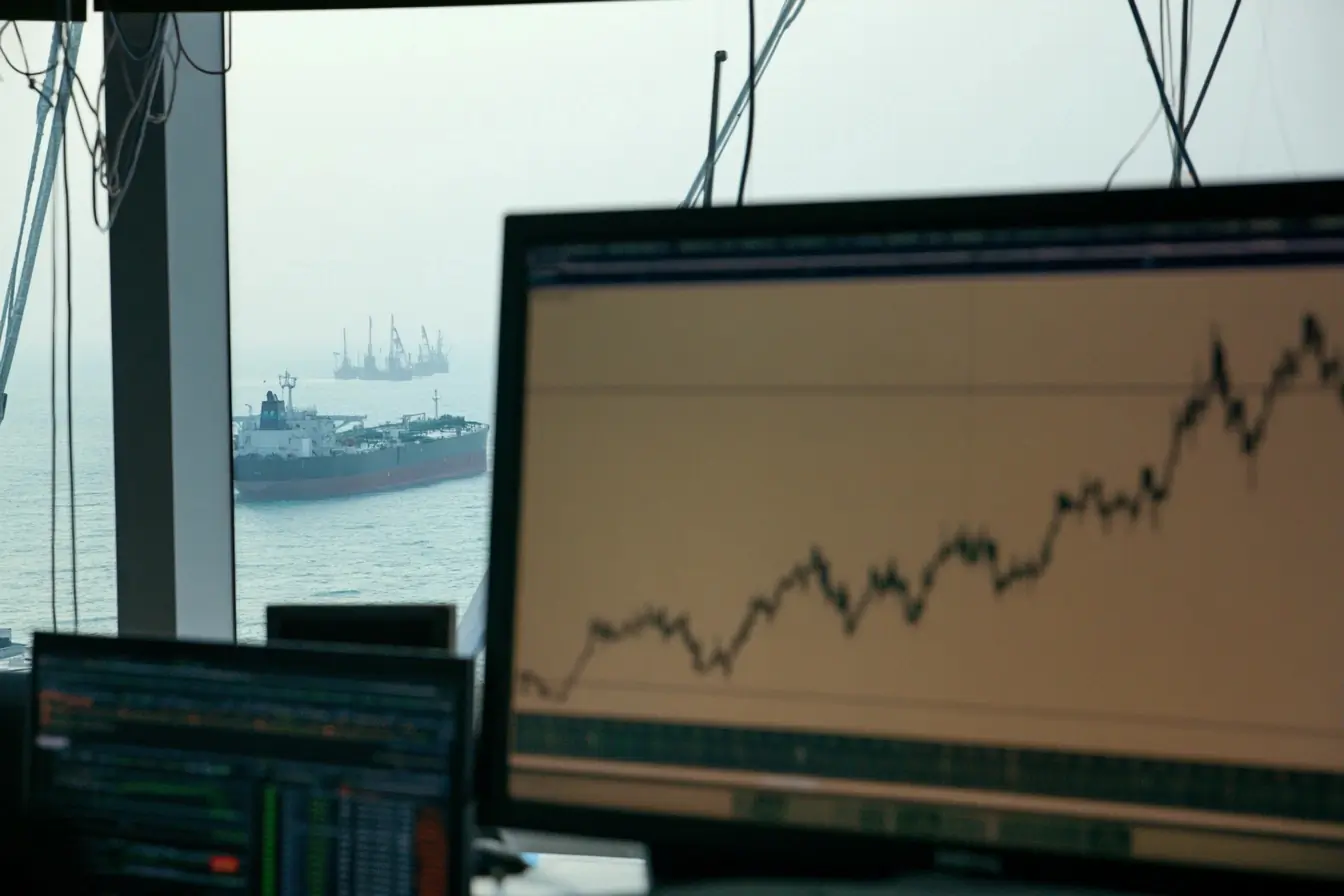 Cours du petrole devant des petroliers
